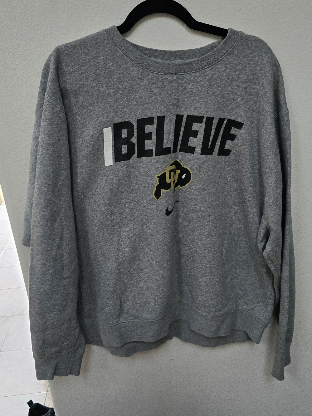 Authentic Nike crewneck sweatshirt. Grey color with 'I BELIEVE' graphic.